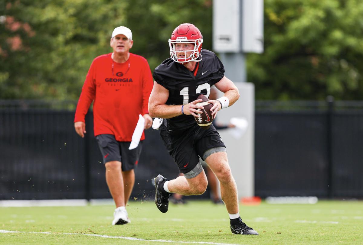 Redshirt sophomore quarterback Brock Vandagriff rolls out to throw during one of Georgia's practices during fall camp. Vandagriff is still in competition with sophomore Gunner Stockton to determine who will serve as Carson Beck's top backup to open the 2023 season.